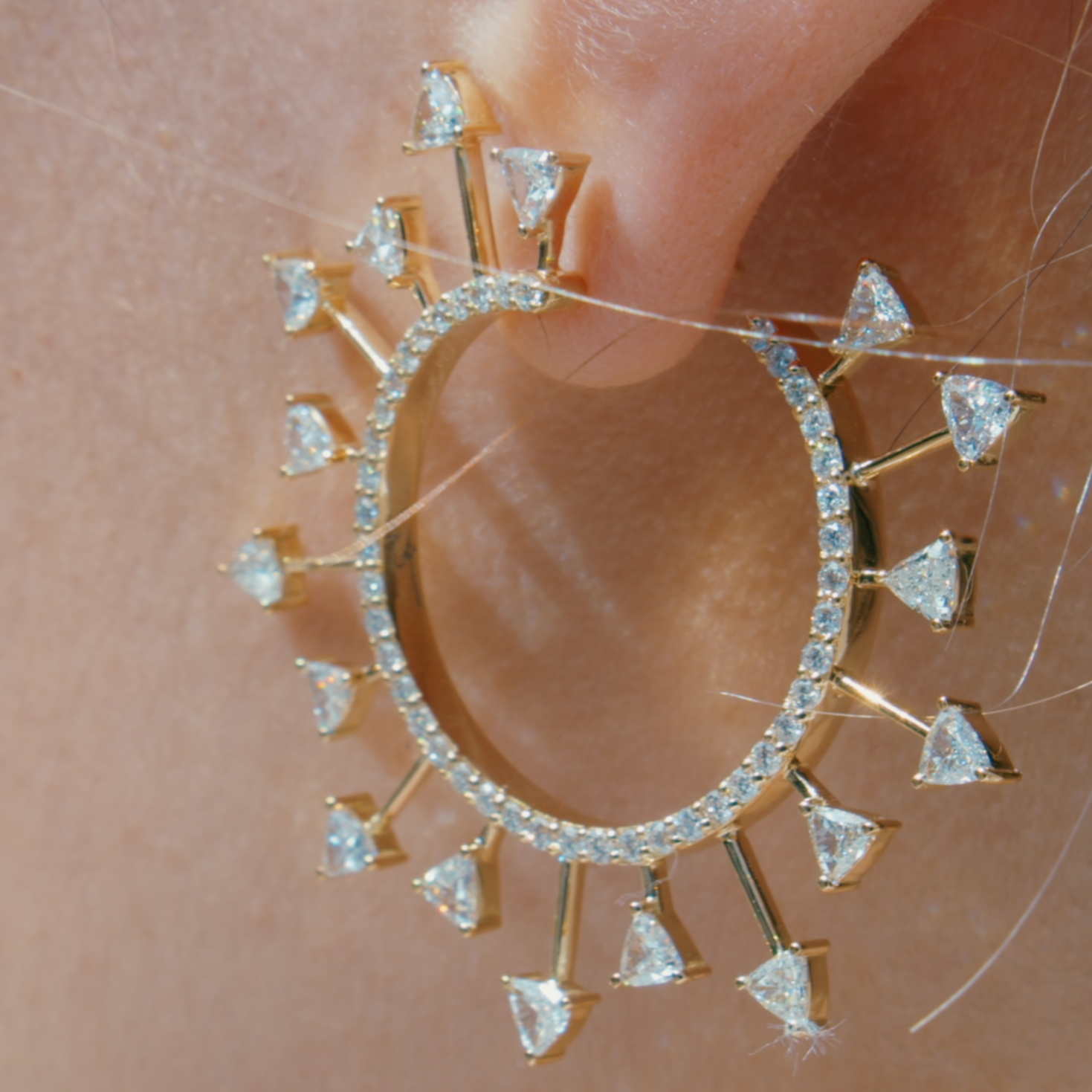 SunScape earrings displayed on model 